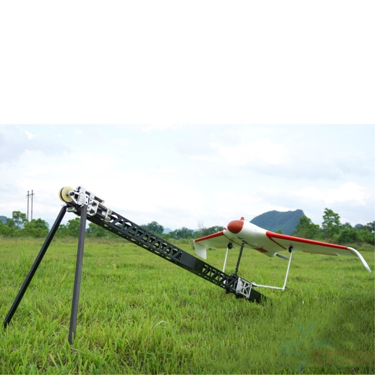UAV catapult launcher for Skywalker X8 and X5 in a grassy field.